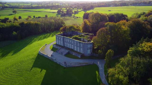 High-angle shot of an old castle in the green park and valley in Limerick, Ireland.
