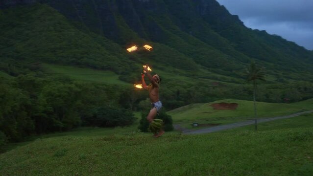 Samoan Fire Knife Dancer At Dusk