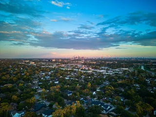 Foto op Canvas Horizontal aerial view of Houston, Texas skyline from a suburban neighborhood under blue sky © Blue Lemon Photo/Wirestock Creators