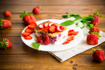 cooked cottage cheese casserole with berry and strawberry filling in a plate