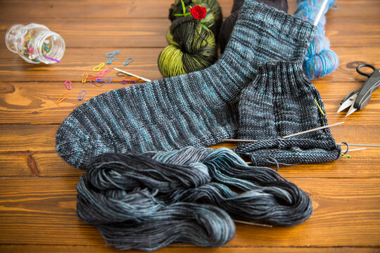 Set for hand knitting warm winter socks made of natural woolen yarn.
