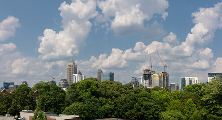 Fototapeta na wymiar Downtown Atlanta Skyline showing several prominent buildings and hotels under a blue sky.