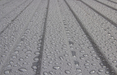 Roof sheet metal profiled with water drops,water bubbles on the roof after rain
