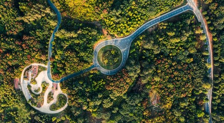 Aerial view of  a roundabout in the Huanglong Mountain Forest Park © Zhou Chenxiao/Wirestock Creators