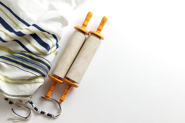 Torah scroll with Tallit on a light background