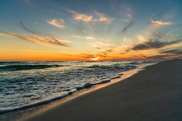 Fototapeta na wymiar Beautiful view of a seacoast against a sunset sky background