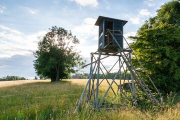 Beautiful shot of a wooden hunting watch tower in a field