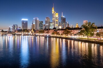 Fototapeta na wymiar Evening skyline of Frankfurt across the river, Germany