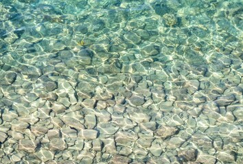 Pebbles seen through the pure sea water, Piran, Slovenia.