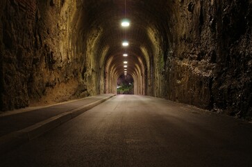 Fototapeta na wymiar Empty arched road tunnel with lighting