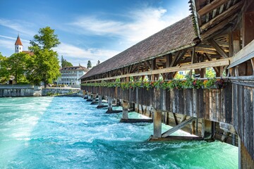 Beautiful Chapel bridge in Thun, Switzerland over a turquoise lake