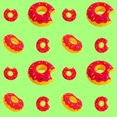 Bright inflatable donut ring pattern on green background.