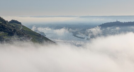Aerial view of the river and hills hidden in clouds. Bingen am Rhein, Germany.