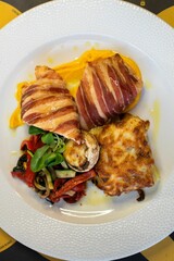 Top view of a meal with bacon and potato