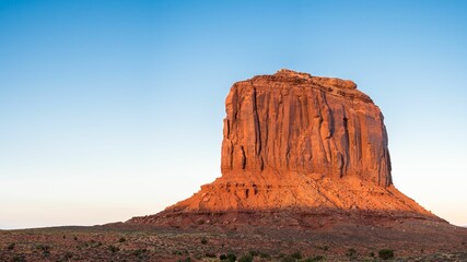 Tall beautiful red canyon with a blue sky on the horizon