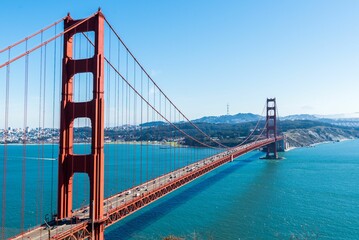 Drone view of the Golden Gate Bridge over the turquoise ocean in San Francisco, California, USA