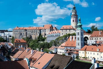 Obraz premium Drone view of the cityscape of Cesky Krumlov with the Cesky Krumlov Castle Tower in Czechia