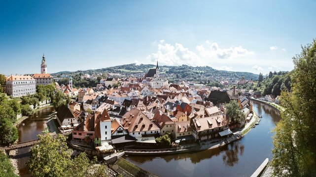 Drone view of the cityscape of Cesky Krumlov with historical buildings and cathedrals in Czechia