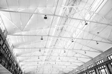 white hall, metal roof, lamps