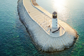 Amazing aerial view of lighthouse and dam on Lustica bay near Tivat, Montenegro on sunny day.