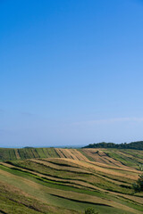 Fototapeta na wymiar Colorfully land terraces planted, wheat, in a beautiful sky, Albania Spille