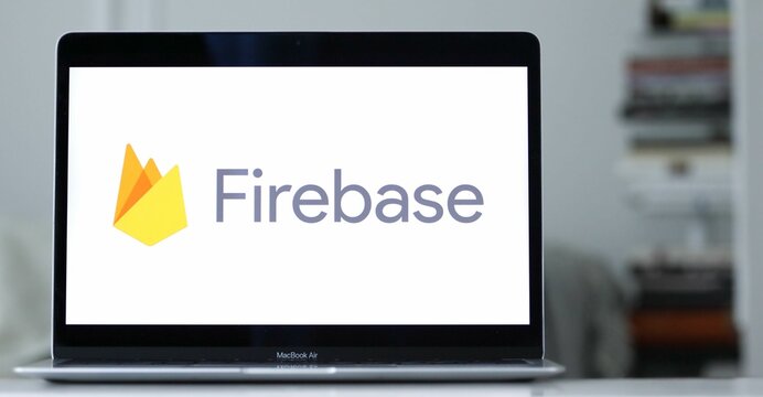 Logo of Firebase, an app development software owned by Google, displayed on laptop screen.