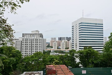 Obraz na płótnie Canvas Office building and industrial estate in front of high-rise residential area, Singapore
