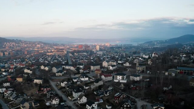 Aerial drone shot of Drammen in Norway in winter with cloudy sky in the background