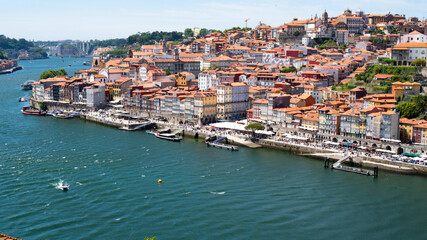 Fototapeta na wymiar Top view of the Douro river and the coast of the old city of Porto, Portugal.
