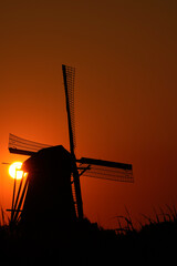 A Dutch windmill in World Heritage Kinderdijk during sunset, knowns as 'Nederwaard Molen No. 3'