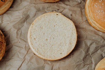 Closeup of freshly-baked buns arranged on a brown paper