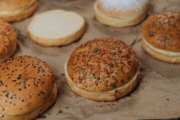 Closeup of freshly-baked buns arranged on a brown paper