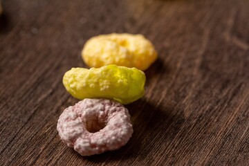 Closeup of colorful breakfast cereal on a wooden surface