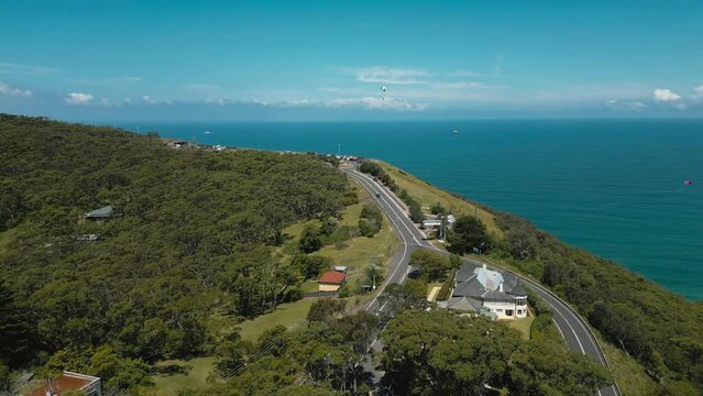 Aerial video of paragliders flying over Stanwell Park and Bald Hill, Wollongong, Australia