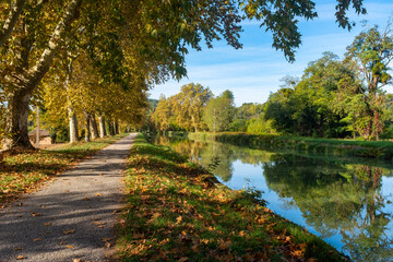 Canal of the Garonne River in autumn near Moissac, France