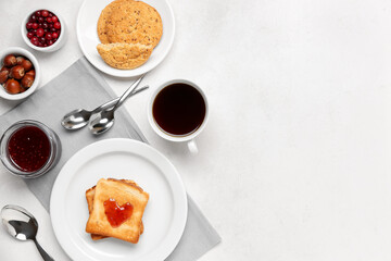 Plate with tasty toasts, cranberry jam, cookies and cup of coffee on light background