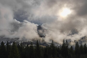 Dramatic ambiance of white clouds over the Gantrisch Mountain in Swiss Alps