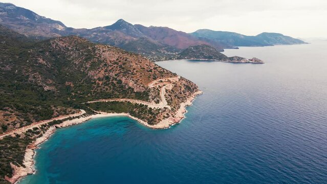 Established aerial shot of Aegean sea coast of Datca peninsula in Turkey at cloudy day