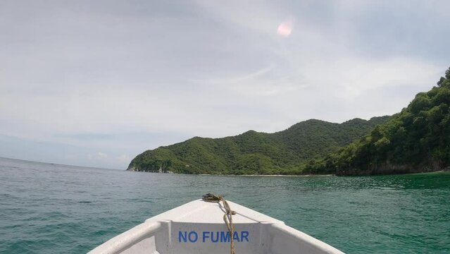 Beautiful view of the Playa Cristal in Tayrona Park, Santa Marta, Colombia from a boat on the water