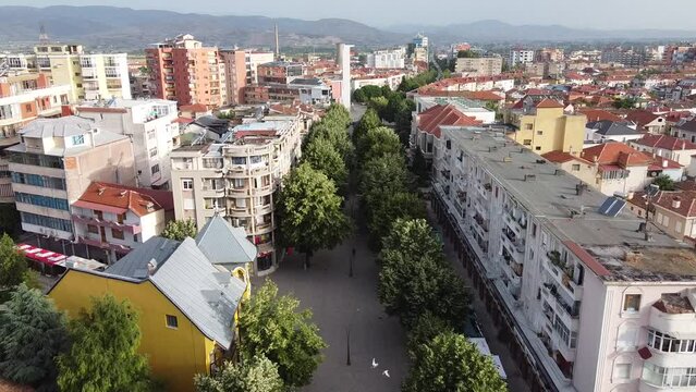 Drone flying over streets and buildings in Korce city in Albania