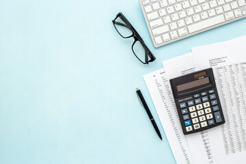 Business accounter working place with taxes and calculator