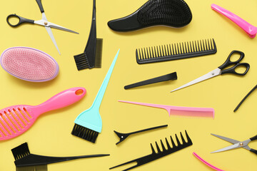 Composition with hairdressing accessories on yellow background
