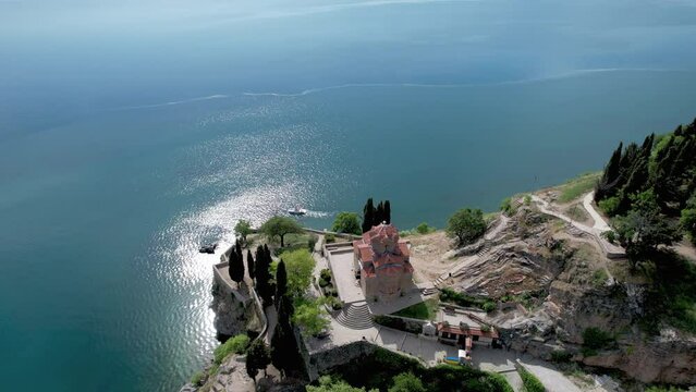 Aerial view of Ohrid with Kaneo beach and church. UNESCO protected heritage - Macedonian Orthodox Church of St. John the Evangelist, located on a cliff above the Kaneo beach