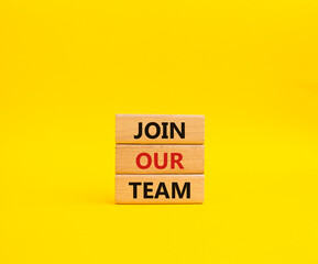 Join our team symbol. Wooden blocks with words Join our team. Beautiful yellow background. Business and Join our team concept. Copy space.