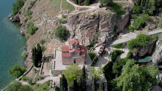 Aerial view of Ohrid with Kaneo beach and church. UNESCO protected heritage - Macedonian Orthodox Church of St. John the Evangelist, located on a cliff above the Kaneo beach