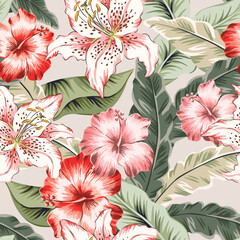 Tropical lily and hibiscus flowers, palm leaves, light beige background. Seamless pattern. Vector illustration. Exotic plants. Summer beach floral design. Paradise nature