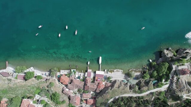 Aerial view of Ohrid with Kaneo beach and church. UNESCO protected heritage - Macedonian Orthodox Church of St. John the Evangelist, located on a cliff above the Kaneo beach