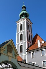 Fototapeta na wymiar Vertical shot of St. Jost Church under clear blue sky in Cesky Krumlov town in the Czech Republic