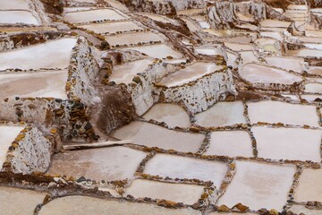 Salt evaporation ponds in Maras Salt Mines in the city of Cusco in the Sacred Valley, Peru
