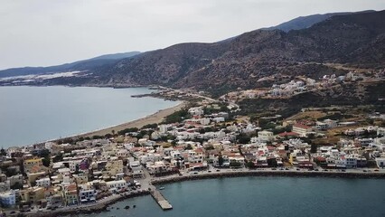 Aerial view of a coastal town surrounded by the sea in Palaiochora of Crete, Greece
